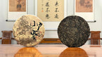 2024 Xiao Hu Sai Raw Pu-erh Tea Cake presented in a traditional Chinese tea room atmosphere