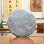 2024 Xiao Hu Sai Raw Pu-erh Tea Cake wrapped in traditional Yunnan tea cotton paper