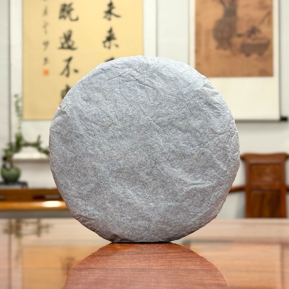 2024 Xiao Hu Sai Raw Pu-erh Tea Cake wrapped in traditional Yunnan tea cotton paper