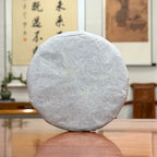 2025 Bai Mu Dan White Tea Cake wrapped in traditional cotton packaging for proper storage.