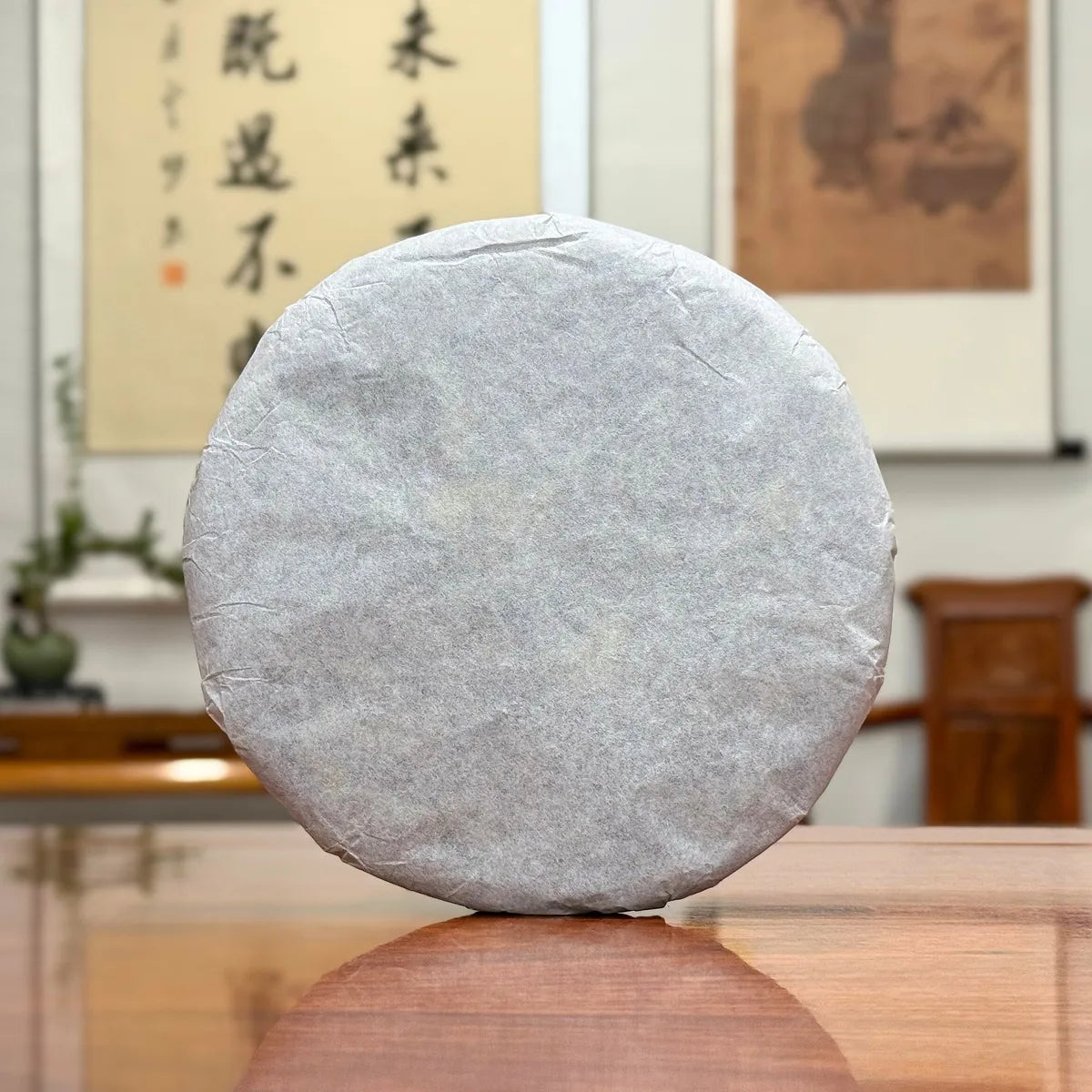 2025 Bai Mu Dan White Tea Cake wrapped in traditional cotton packaging for proper storage.