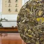 Close-up of 2025 Bai Mu Dan White Tea Cake showing detailed tea leaves and natural cake texture.