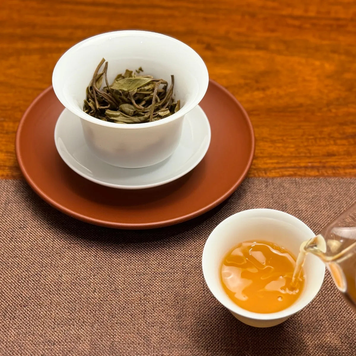 Bright tea liquor of 2025 Bai Mu Dan White Tea Cake showing its fresh, floral character.