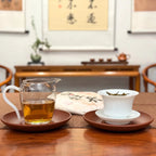 2025 Bai Mu Dan White Tea Cake presented alongside its brewed tea liquor.
