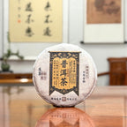 2025 Raw Pu-erh Tea Cake (Sheng Pu'er) packaging displayed in a Chinese tea shop