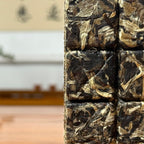 2025 Yunnan White Tea Mini Bricks showing compressed dry tea leaves with natural texture