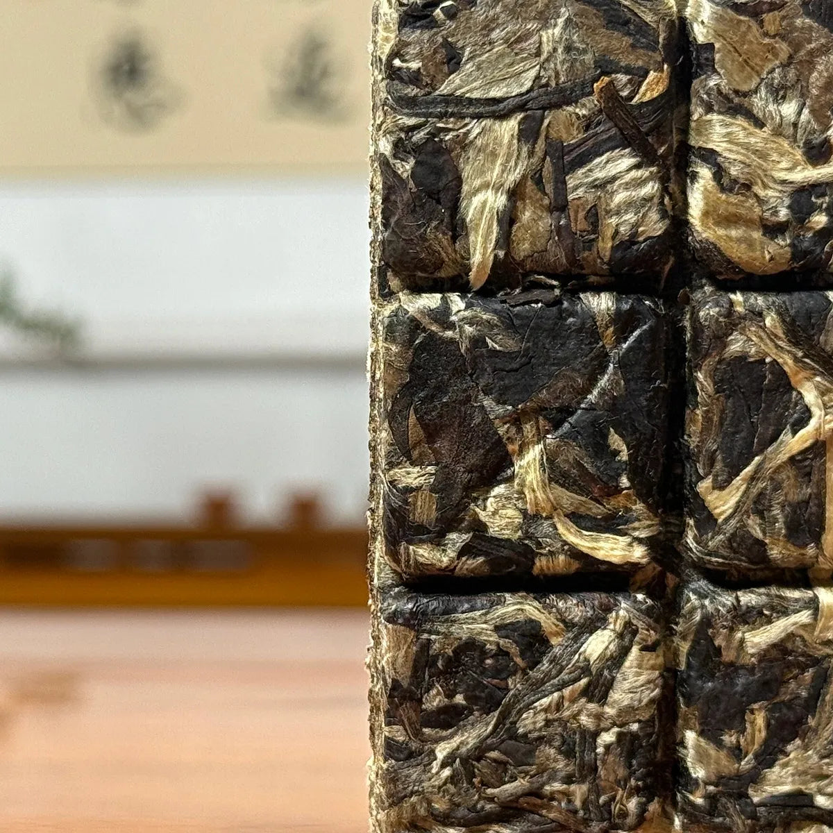 2025 Yunnan White Tea Mini Bricks showing compressed dry tea leaves with natural texture