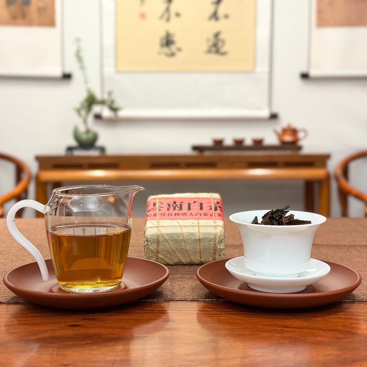 2025 Yunnan White Tea Mini Bricks displayed with brewed tea and individual mini bricks