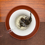 2026 Bulang Mountain Raw Pu-erh Tea Cake being brewed in a traditional tea setting