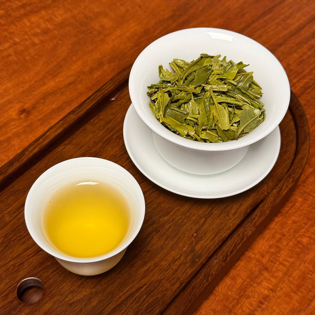 Anji Bai Cha Green Tea (Anji White Tea) brewed loose tea liquor showing bright green color and clarity