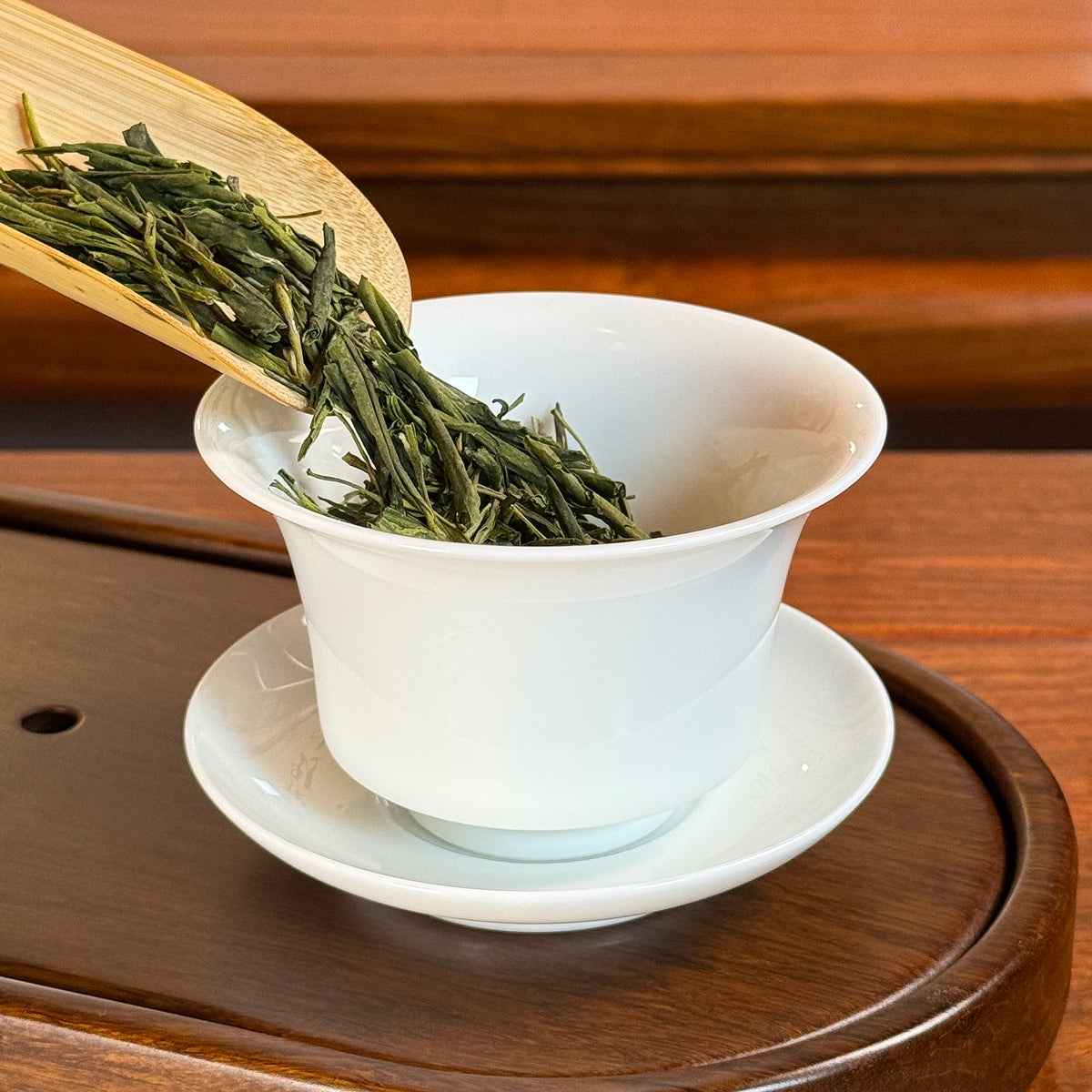 Anji Bai Cha Green Tea (Anji White Tea) Chinese green tea poured into teapot