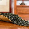 Bi Luo Chun Green Tea (Green Snail Spring) dry leaves close-up shot in Chinese Tea Group tea house