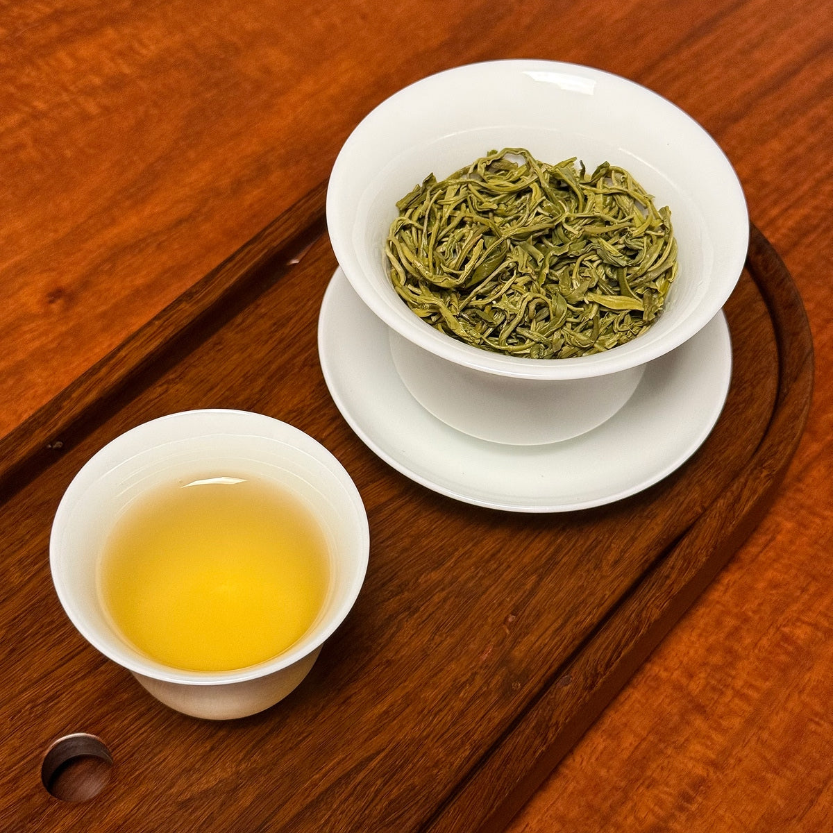 Bi Luo Chun Green Tea (Green Snail Spring) brewed tea liquor showing bright green color and clarity