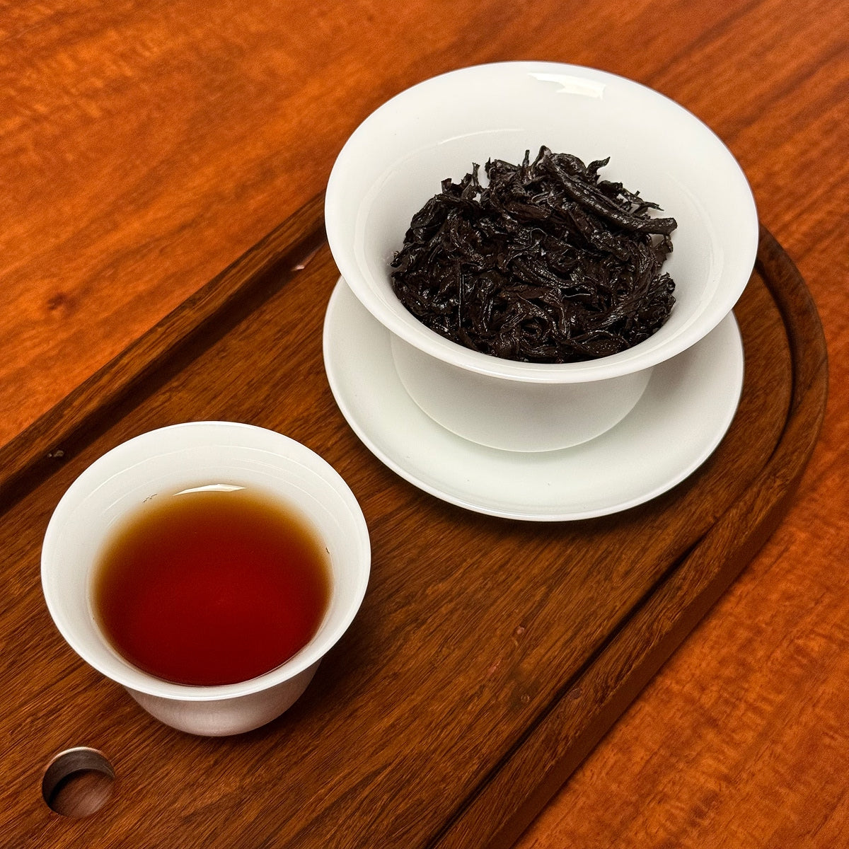 Da Hong Pao Oolong Tea (Big Red Robe) brewed tea liquor with amber color and clarity