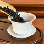 Da Hong Pao Oolong Tea (Big Red Robe) Wuyi Mountain dry leaves poured into teapot for brewing