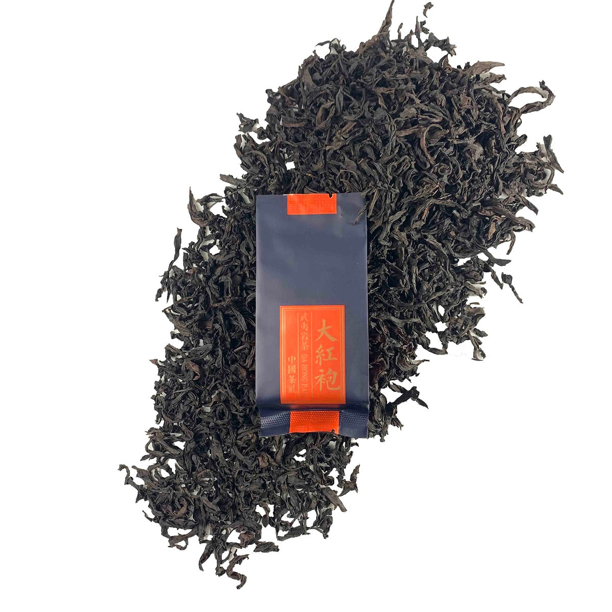 Dry tea leaves with packaging of Oolong Gongfu Tea Sachets Da Hong Pao, showing premium quality