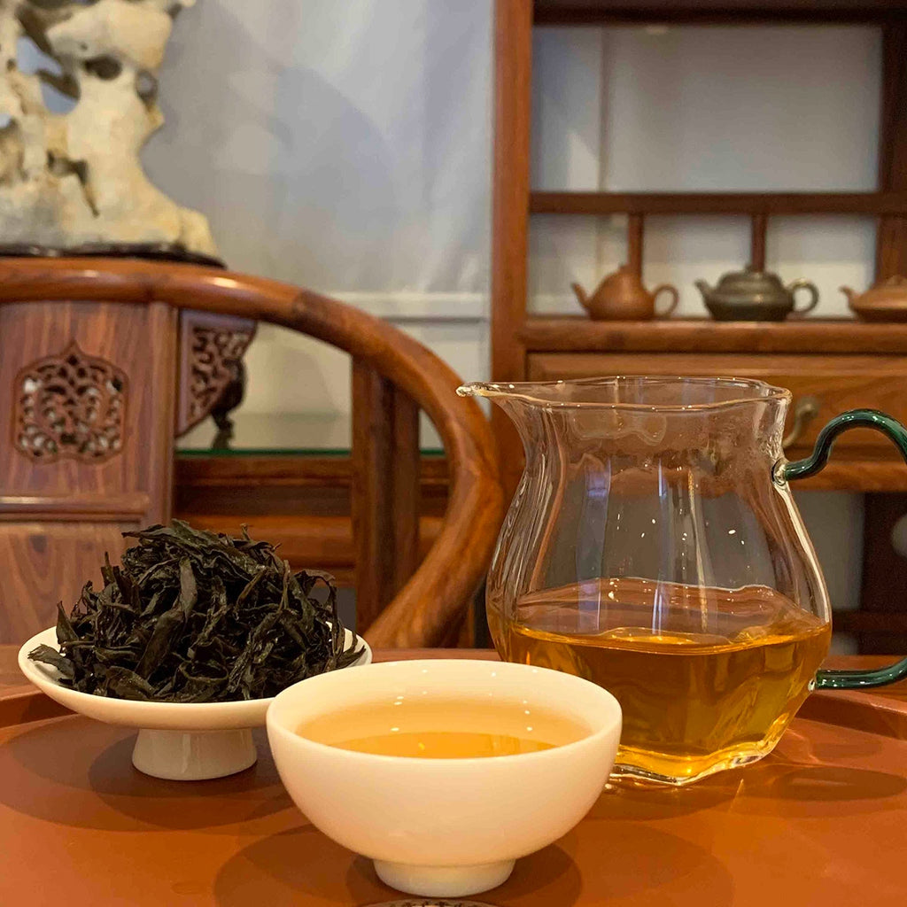 Brewed tea leaves and tea liquor of Da Hong Pao Oolong Gongfu Tea Sachets, revealing its rich aroma