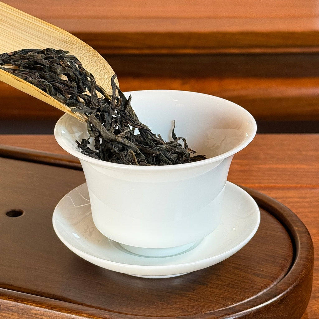 Dan Cong Oolong Tea Da Wu Ye (Big Dark Leaf) - Phoenix Mountain dry leaves poured into gaiwan for brewing