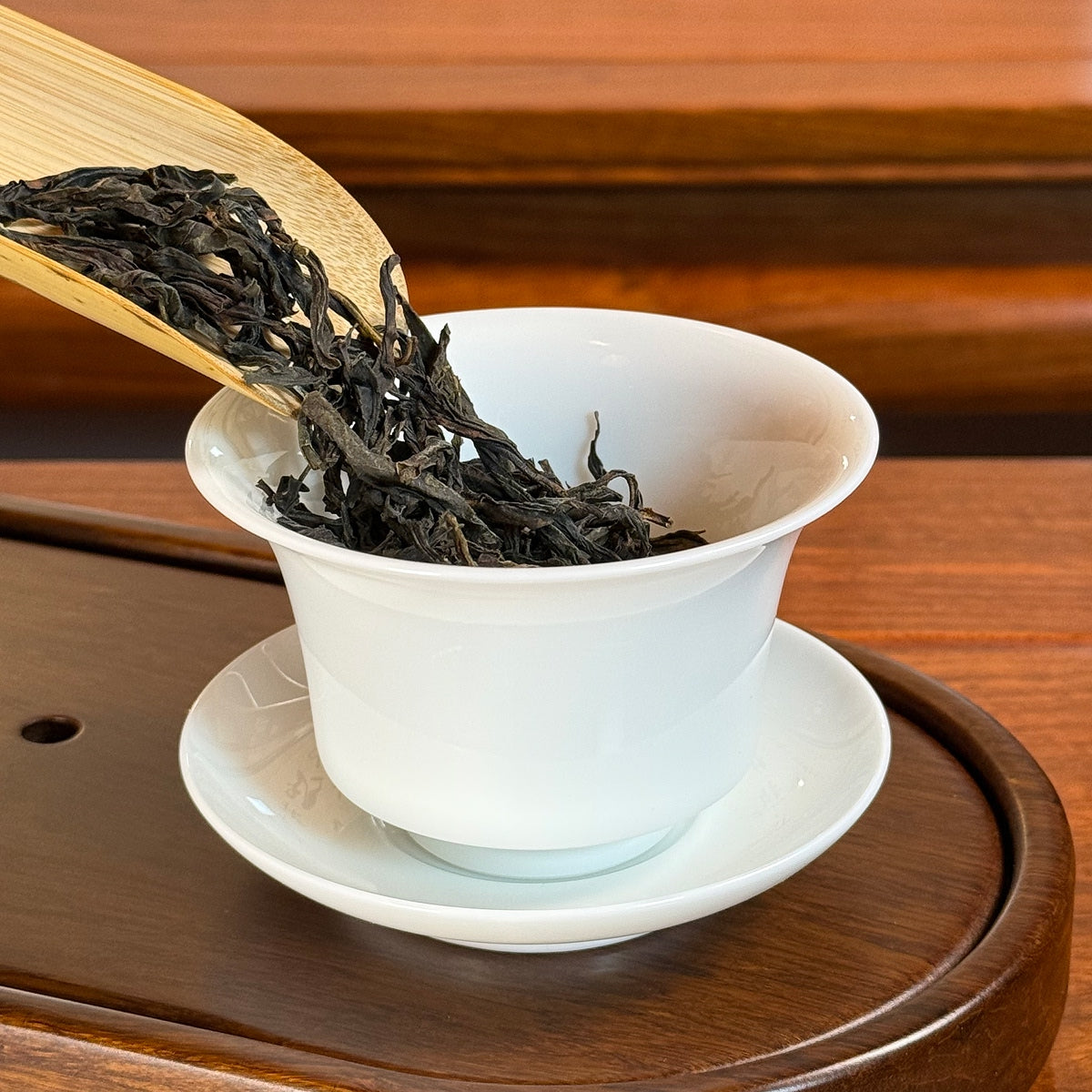 Dan Cong Oolong Tea Da Wu Ye (Big Dark Leaf) - Phoenix Mountain dry leaves poured into gaiwan for brewing
