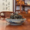 Dragon Pearl Pu-erh Tea (Dragon Ball) 2023 Yiwu displayed in a traditional Chinese tea house