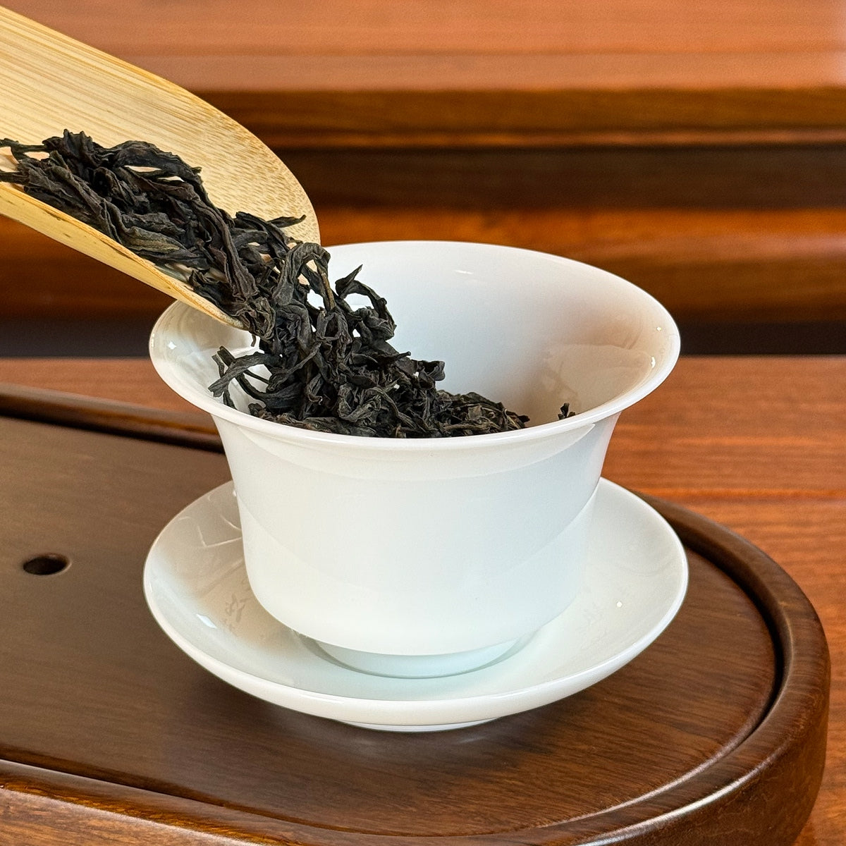 Phoenix Oolong Tea Dan Cong Huang Zhi Xiang (Yellow Branch Aroma) dry leaves poured into gaiwan for brewing