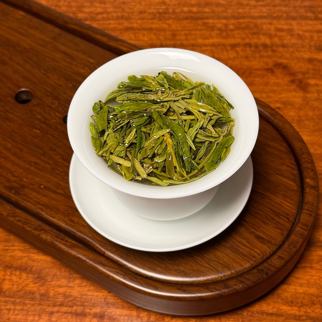 Long Jing Green Tea (Dragon Well) premium Chinese green tea brewing showing infusion process
