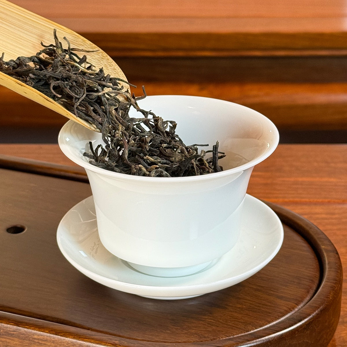 Loose Leaf Raw Pu-erh Tea 2022 Bing Dao being poured into a gaiwan