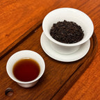 Infused tea liquor and wet leaves of Shou Pu-erh Tea, 2012 Imperial Grade, after steeping