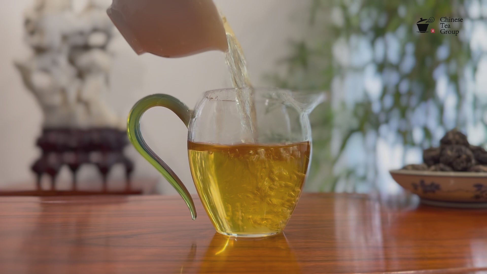 Freshly brewed tea liquor of Raw Pu-erh Dragon Pearl Tea (Dragon Ball) - 2023 Yiwu at a Chinese Tea Group in China