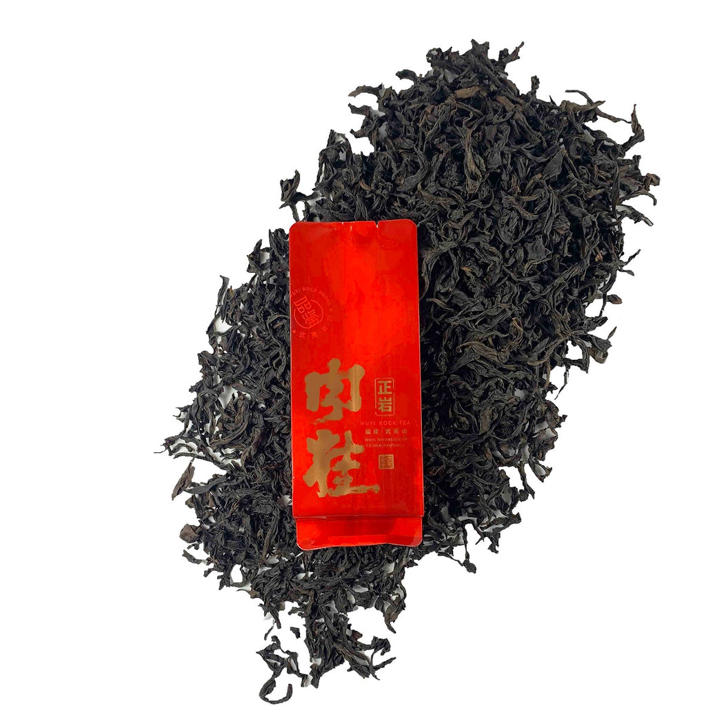 Dry loose leaves with packaging of Gongfu Tea Sachets Rou Gui Rock Oolong, showing premium quality