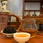 Brewed tea and tea bags of Gongfu Tea Sachets Rou Gui Rock Oolong, highlighting its rich flavor