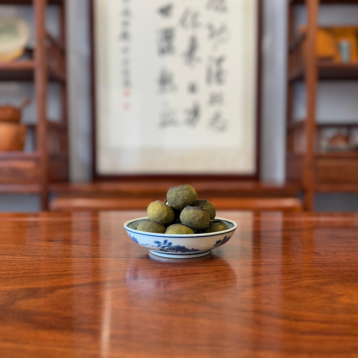 Tangerine Pu-erh Tea (Xiao Qing Gan) placed on tea table in physical store