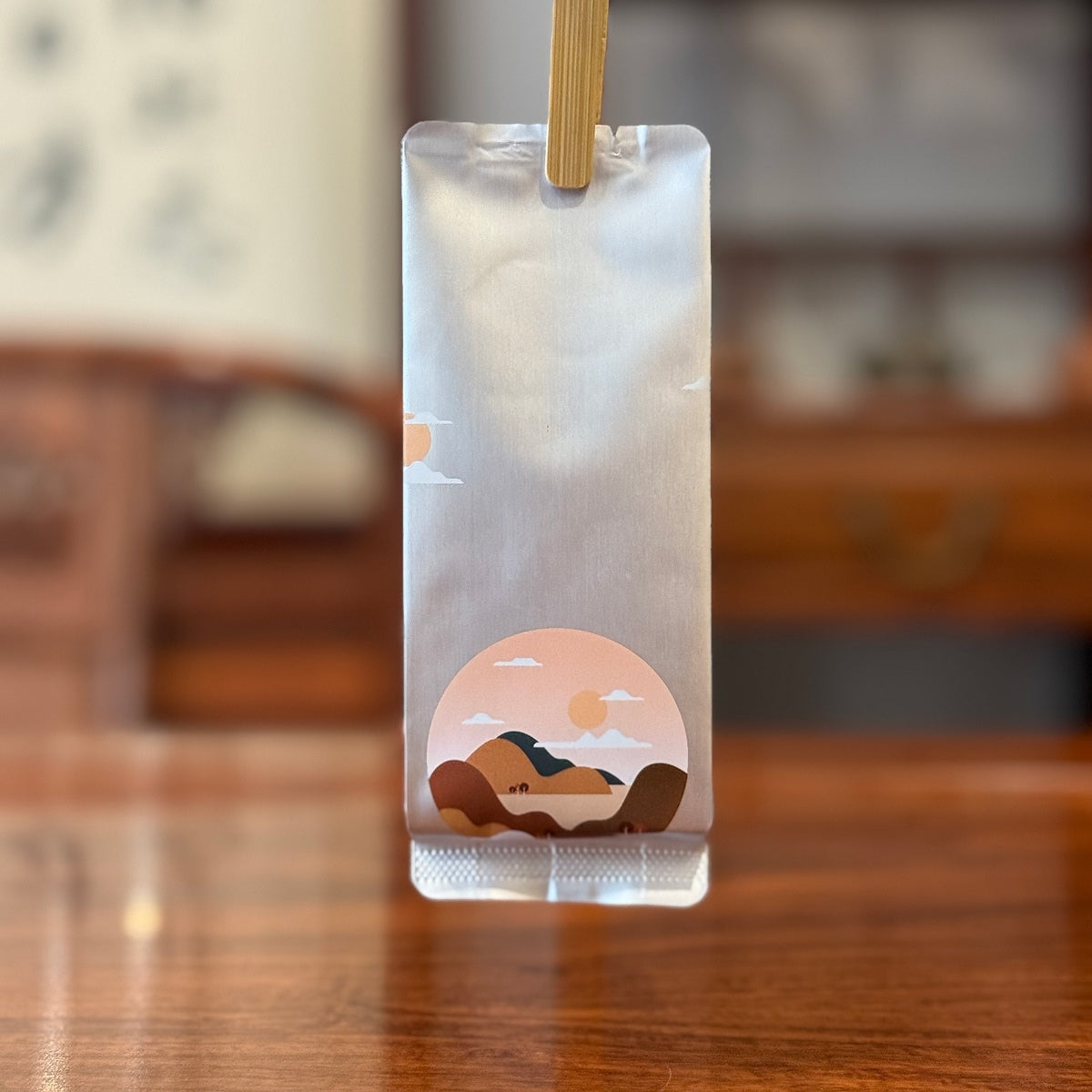 Outer packaging of Tie Guan Yin Oolong Gongfu Tea Sachets, showcasing elegant tea bag design