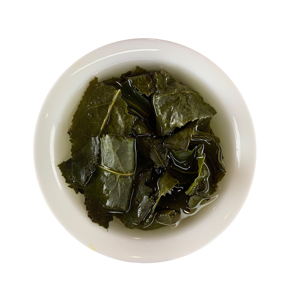 Brewed Anxi Tie Guan Yin Oolong Tea Sample at Chinese Tea Group, showing tea liquor