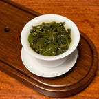 Tie Guan Yin Tea (Ti Kuan Yin / Iron Goddess) premium Chinese oolong tea brewing showing infusion process