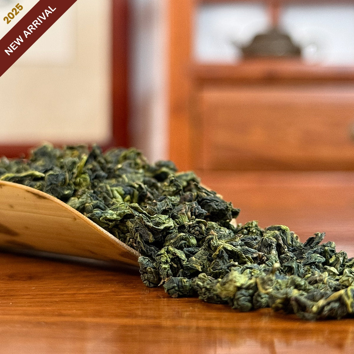 Tie Guan Yin Tea (Ti Kuan Yin / Iron Goddess) dry leaves close-up in Chinese Tea Group store