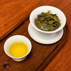 Tie Guan Yin Tea (Ti Kuan Yin / Iron Goddess) brewed oolong tea liquor showing amber color and clarity