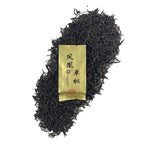 Dry loose leaves with packaging of Dan Cong Oolong Gongfu Tea Sachets, showing premium quality