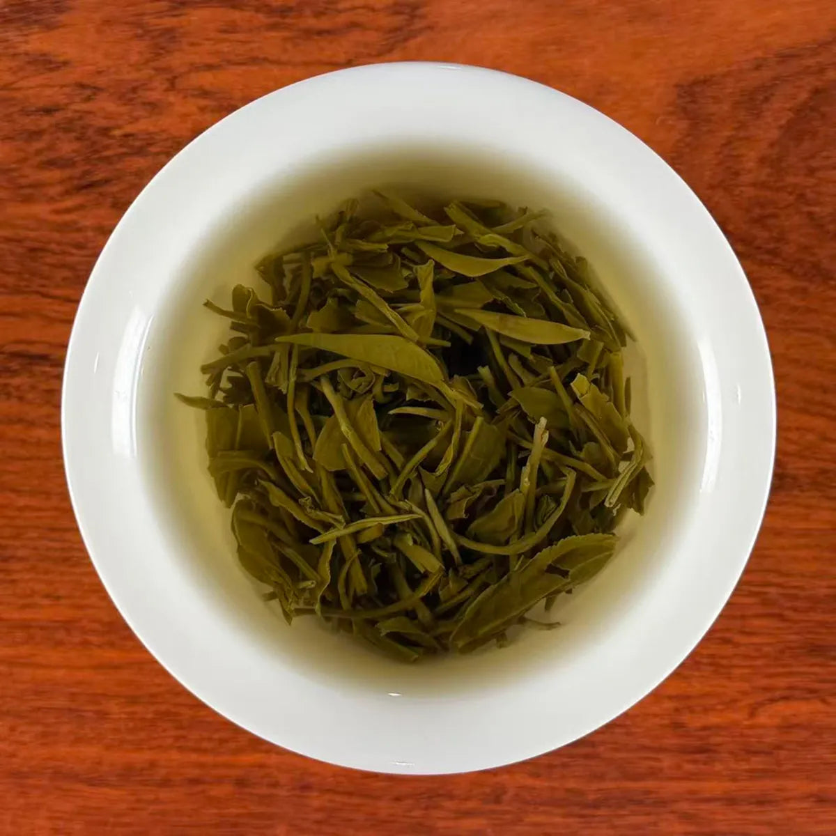 Xin Yang Mao Jian Green Tea (Green Tip Tea) sample brewing in cup – from Henan, China