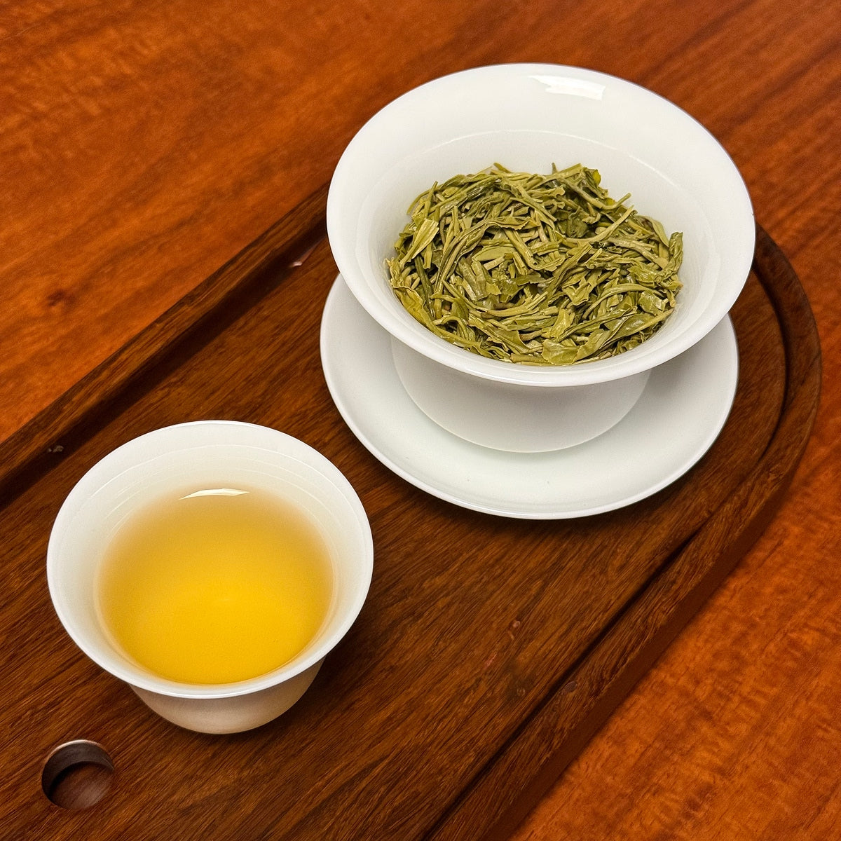 Xin Yang Mao Jian Green Tea (Green Tip Tea) brewed tea liquor from original region showing bright green color