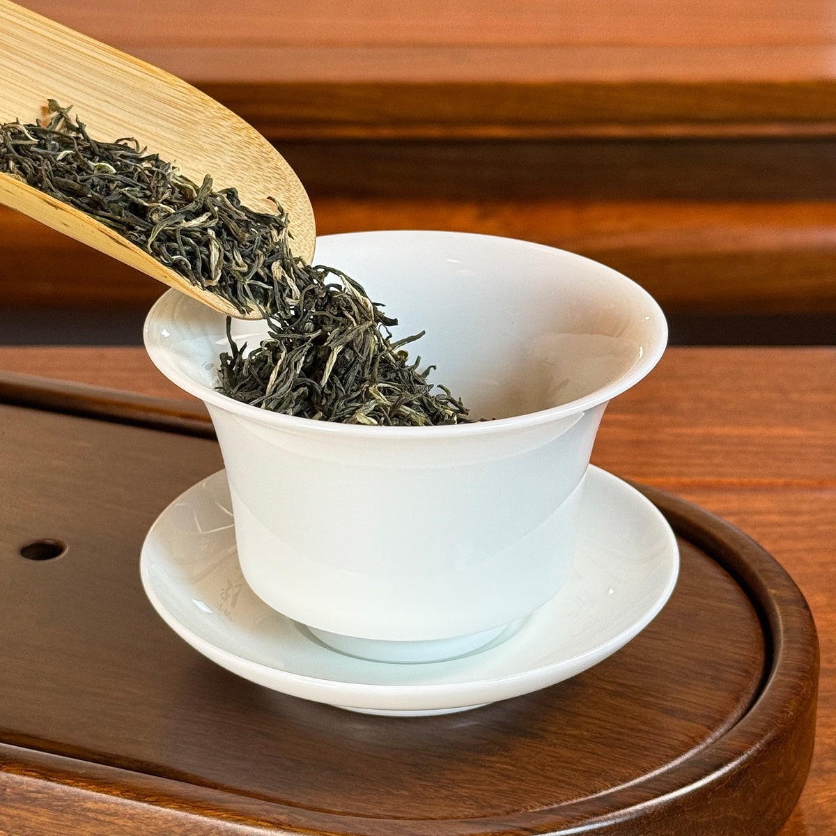Xin Yang Mao Jian Green Tea (Green Tip Tea) origin dry leaves poured into gaiwan for brewing