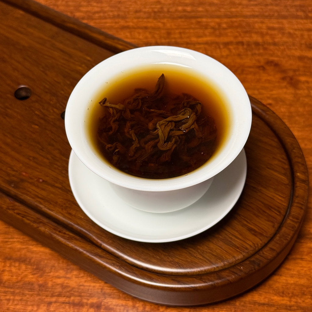 Authentic Yunnan Golden Snail Black Tea (Dian Hong Jin Luo) brewing from original Chinese tea region