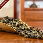 Yunnan Golden Snail Black Tea (Dian Hong Jin Luo) dry leaves detail shot in Chinese Tea Group store