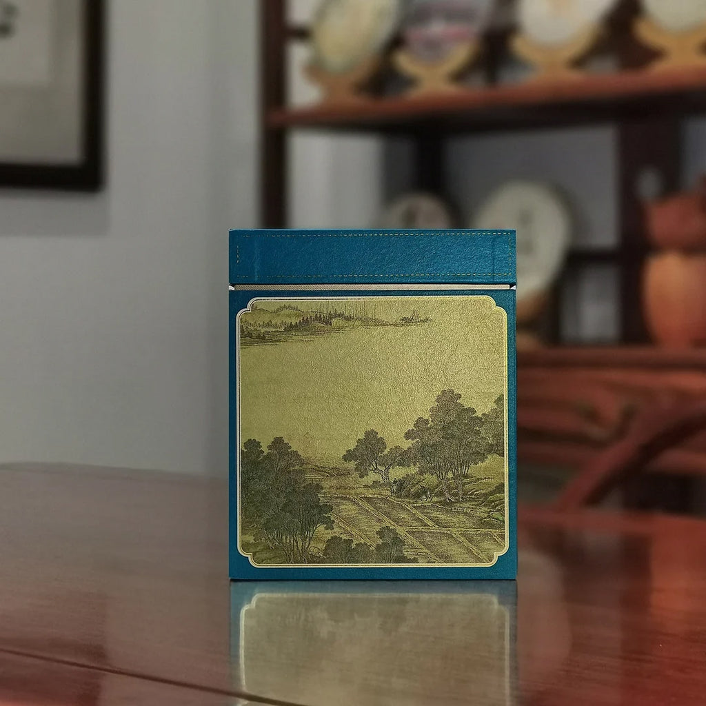 Yunnan Loose Leaf Raw Pu-erh Tea Gift Box – 2017 Aged depicting serene countryside illustration