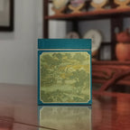 Yunnan Loose Leaf Raw Pu-erh Tea Gift Box – 2017 Aged featuring a lively village illustration
